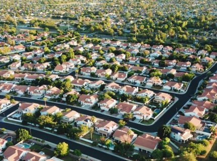 suburbanize